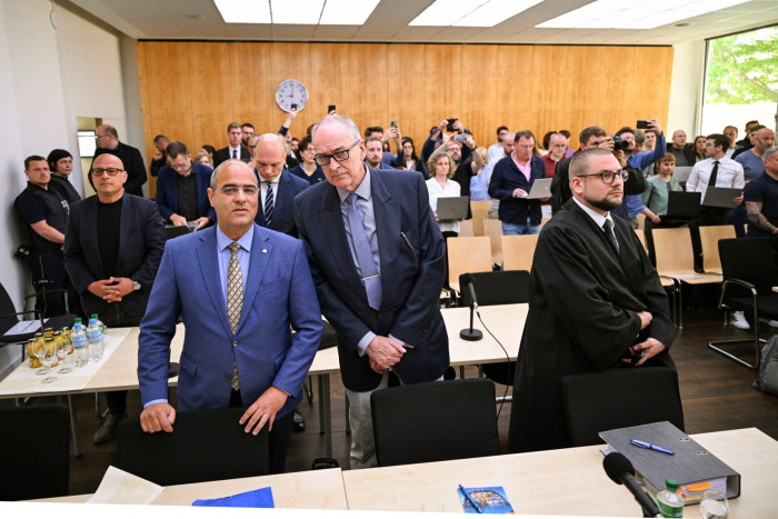 Peter Boehringer and Roman Reusch standing inside the courtroom