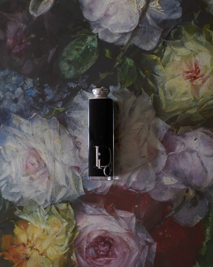 Her favourite lipstick, Dior Addict 667 Diormania, on a painted table recently bought at a Valentina Cortese auction