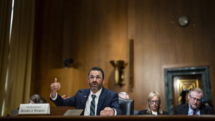 Danny Werfel in a suit and tie speaking at a US Senate committee hearing