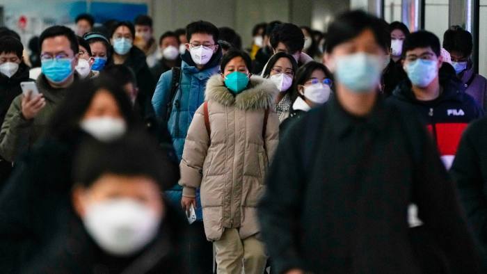 Masked commuters in Beijing
