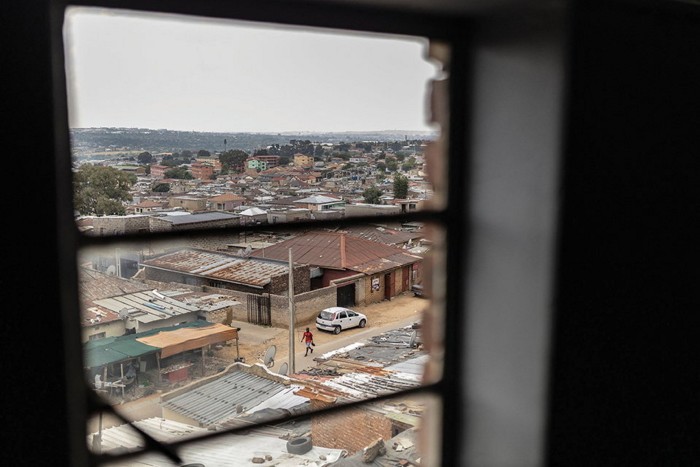 A view of an impoverished town as seen through a window