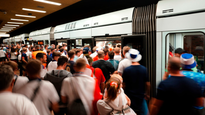 England fans enter a public transport train for the stadium ahead for the round of sixteen match between England and Slovakia at the Euro 2024 football tournament in Gelsenkirchen, Germany