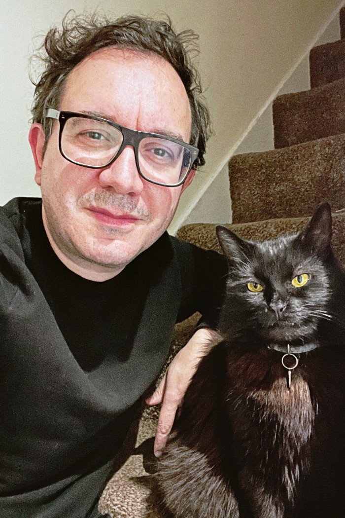 Art director Carlo Apostoli with his cat Barry