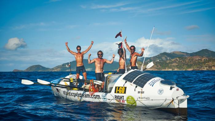 The author (far left) and his crewmates arriving in Antigua 48 days after setting off from the Canary Islands, in 2014