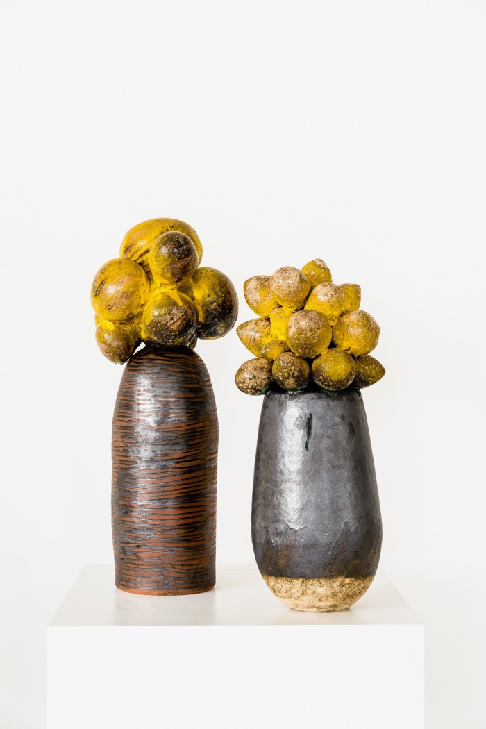 Two of her glazed clay stoneware sculptures, &quot;Umthwalo – Dadobawo&quot; (left) and “Weniamo – Baobab Series” (right)