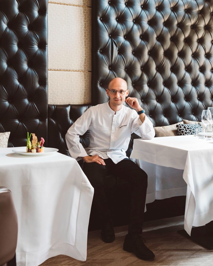 Giannino’s executive chef Andrea Locci – a slim, bald and bespectacled young man – sitting at a table in the restaurant