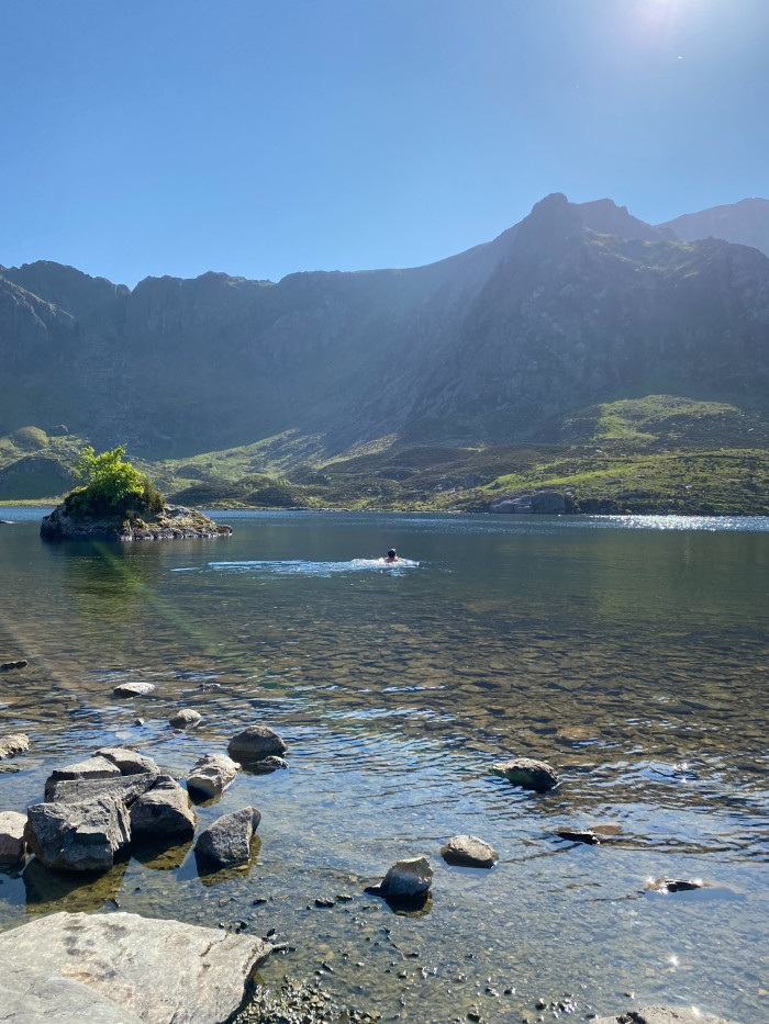The author swims at Cwm Idwal in Snowdonia, Wales