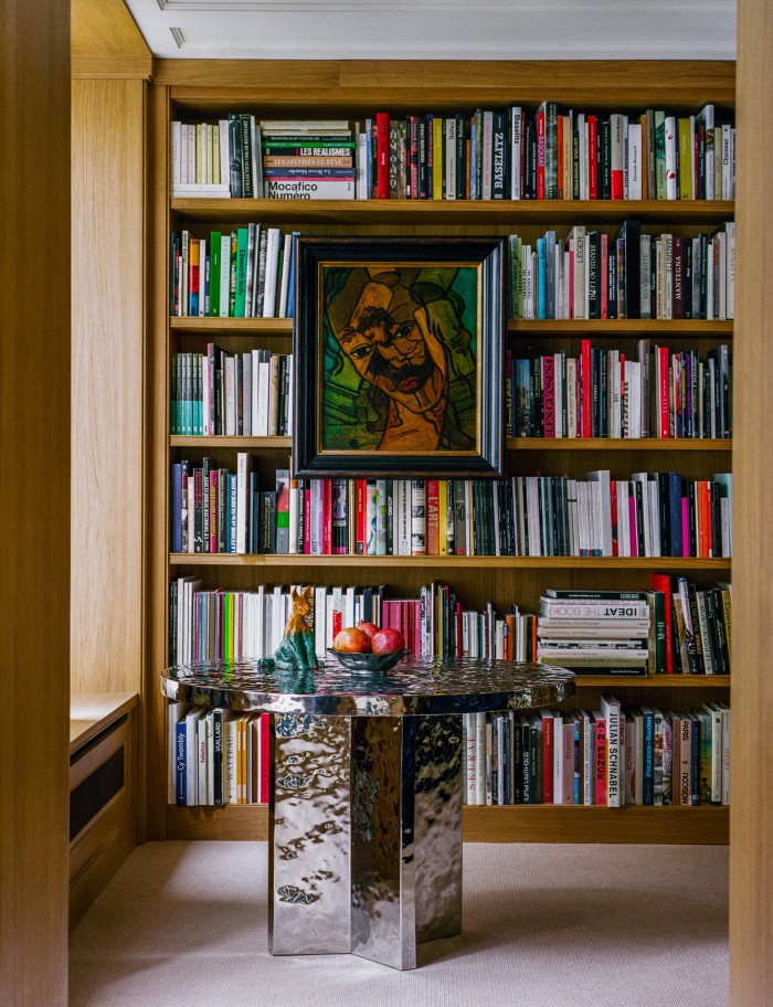 A Festen bespoke table in the library. On the shelves hangs Untitled (Samson et Dalila), c1935, by Francis Picabia