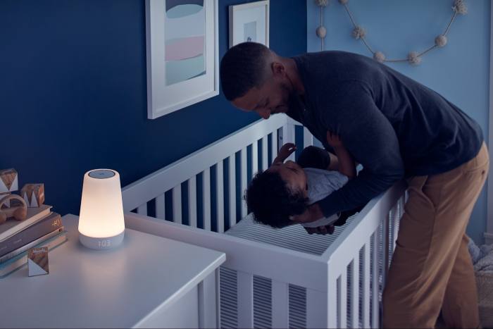 The Hatch rest light glows as a parent tucks a child in