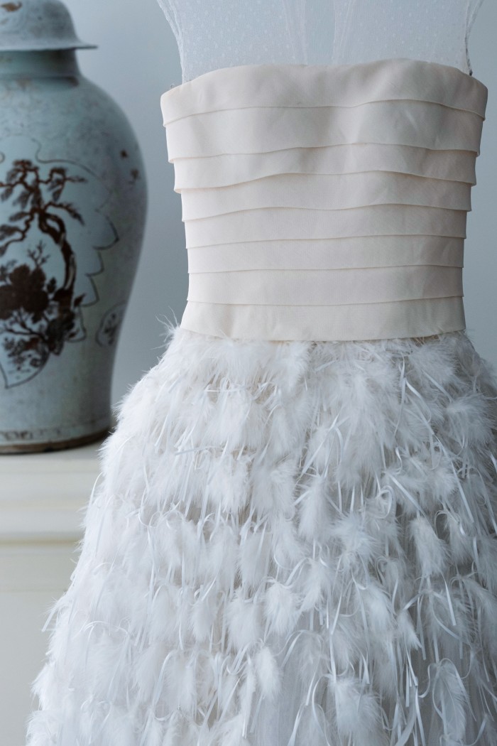 Her feathered wedding gown