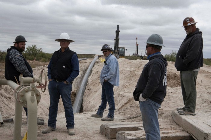 Workers lay a pipeline in Lea County, New Mexico, last September