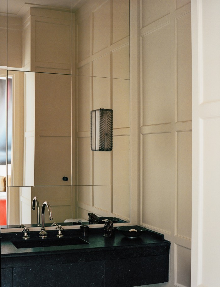 The main bathroom, with tap by Volevatch and wall sconce lights by René Lalique