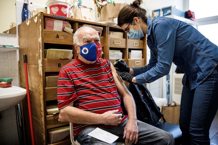 Medical worker administers a jab in Hungary