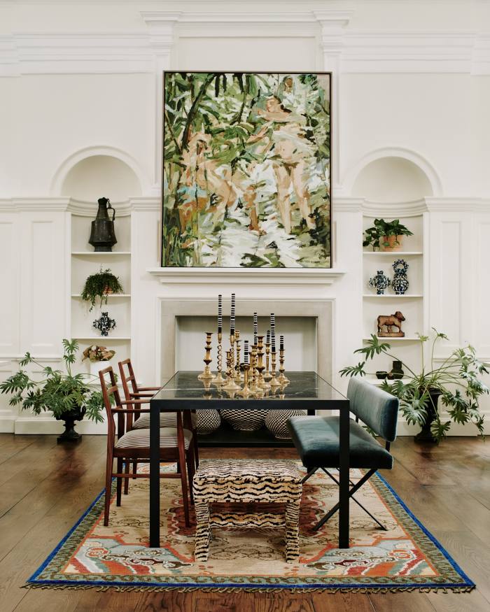 Inside Sophie Ashby’s new showroom in St James’s Park. Items include Foundation, 2022, by Mia Chaplin (on wall), £8,500. Sister by Studio Ashby vintage pinstripe chairs (not for sale), marble dining table, £5,680, vintage brass candlesticks, £50 a pair, Criss Cross bench, £7,500, X-Frame stool, £2,100, and Tiger rug, £3,760