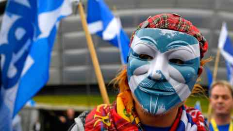 GLASGOW, SCOTLAND - OCTOBER 15:  An Independence supporter in a mask with the Saltire flag on it takes part in a rally outside the Scottish National Party conference on October 15, 2016 in Glasgow, Scotland. Nicola Sturgeon is set to end her party's conference with a speech about a 'new political era' in the UK, stating that Scotland is 'open for business' in the post-Brexit era while also speaking about domestic policy priorities. (Photo by Jeff J Mitchell/Getty Images)