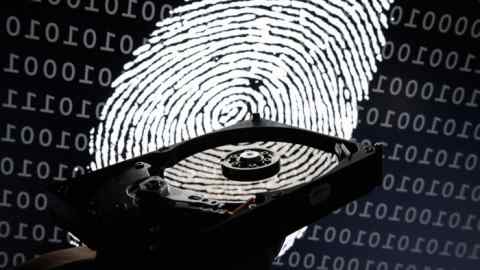 LONDON, ENGLAND - AUGUST 09:  In this photo illustration, a hard drive is seen in the light of a projection of a thumbprint on August 09, 2017 in London, England. With so many areas of modern life requiring identity verification, online security remains a constant concern, especially following the recent spate of global hacks.  (Photo by Leon Neal/Getty Images)