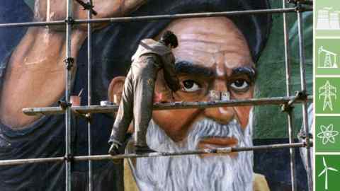 A painter puts the finishing touches on a mural of late Iranian spirtual leader Ayatollah Ruhollah Khomeini at Revolution Square in Tehran February 1. Iranians gathered on Monday at Khomeini's mausoleum in Tehran to mark the day in 1979 when Khomeini flew back to Iran at the end of 15 years of exile to lead the final popular assault on the late shah's pro-Western democracy. - PBEAHULWYDJ
