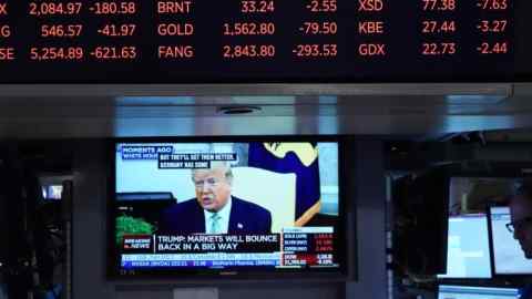 President Donald Trump speaks on television from the White House as stock numbers are displayed on the floor of the New York Stock Exchange on March 12, 2020 in New York. - Wall Street stocks were deep in the red early Thursday, resuming after a 15-minute suspension as the economic pain from the coronavirus deepens and widens. About 25 minutes into trading, the Dow Jones Industrial Average was at 21,505.07, down more than 2,000 points or 8.7 percent.The broad-based S&P 500 tumbled 8.1 percent to 2,519.43, while the tech-rich Nasdaq Composite Index shed 7.9 percent to 7,323.31. (Photo by Bryan R. Smith / AFP) (Photo by BRYAN R. SMITH/AFP via Getty Images)