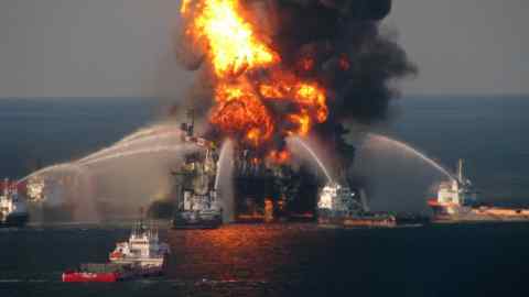 GULF OF MEXICO - APRIL 21: In this handout image provided be the U.S. Coast Guard, fire boat response crews battle the blazing remnants of the off shore oil rig Deepwater Horizon in the Gulf of Mexico on April 21, 2010 near New Orleans, Louisiana. An estimated leak of 1,000 barrels of oil a day are still leaking into the gulf. Multiple Coast Guard helicopters, planes and cutters responded to rescue the Deepwater Horizon's 126 person crew. (Photo by U.S. Coast Guard via Getty Images)
