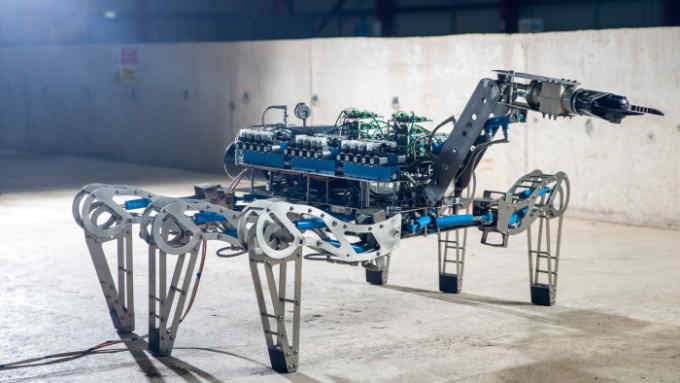 The LATRO, a hydraulically powered robotic spider equipped with grippers and cutting tools, designed to monitor and gather information in a nuclear environment, stands at the Forth Engineering Ltd. offices in Maryport, U.K., on Tuesday, Dec. 20. 2016. Sellafield, the 70-year-old home to Europe's largest nuclear site with 10,000 employees and its own rail service and police and fire departments looks its age and will eventually cost at least £90 billion to properly clean up, says Paul Dorfman, honorary senior researcher at the Energy Institute at University College London. Photographer: Matthew Lloyd/Bloomberg