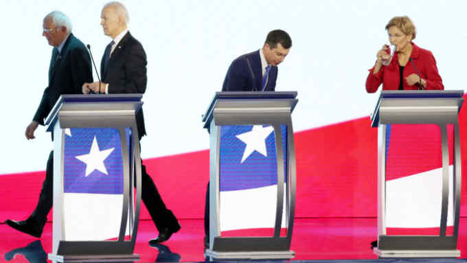 MANCHESTER, NEW HAMPSHIRE - FEBRUARY 07: (L-R) Democratic presidential candidates Sen. Bernie Sanders (I-VT), former Vice President Joe Biden, former South Bend, Indiana Mayor Pete Buttigieg and Sen. Elizabeth Warren (D-MA) stand on stage prior to the start of the Democratic presidential primary debate in the Sullivan Arena at St. Anselm College on February 07, 2020 in Manchester, New Hampshire. Seven candidates qualified for the second Democratic presidential primary debate of 2020 which comes just days before the New Hampshire primary on February 11. (Photo by Joe Raedle/Getty Images)