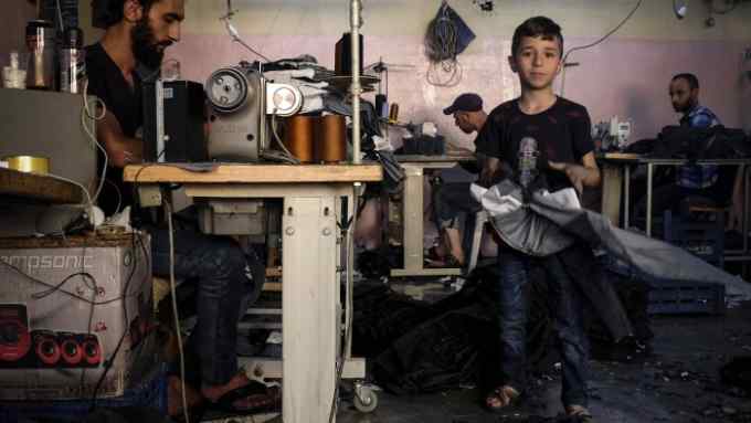 Mohammed Nour Abdullah in the workshop in Gaziantep, where he works 12 hours a day. Photograph by Mary Turner.