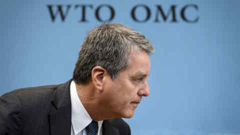 (FILES) In this file photo taken on December 10, 2019 World Trade Organization (WTO) Director General Roberto Azevedo arrives to a WTO general council meeting at the trade intergovernmental organization headquarters in Geneva, a day after the announce of the launch of &quot;intensive&quot; political negotiations to salvage the appellate branch of the body's internal court, which is set to collapse under US opposition. - The World Trade Organization will make an announcement on May 14, 2020 about its Director-General Roberto Azevedo, a spokesman said, following reports that he is planning to step down before the end of his term next year. (Photo by Fabrice COFFRINI / AFP) (Photo by FABRICE COFFRINI/AFP via Getty Images)