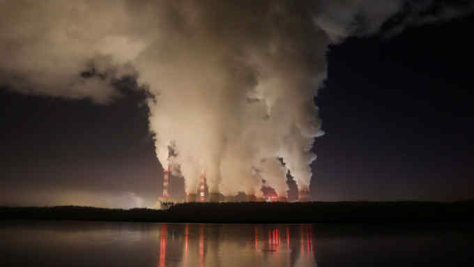 Smoke and steam billows from Belchatow Power Station, Europe's largest coal-fired power plant operated by PGE Group, at night near Belchatow, Poland December 5, 2018. Picture taken December 5, 2018. REUTERS/Kacper Pempel - RC1A534A9710