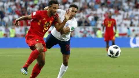 Belgium's Moussa Dembele vies for the ball with England's Trent Alexander-Arnold, right, during the group G match between England and Belgium at the 2018 soccer World Cup in the Kaliningrad Stadium in Kaliningrad, Russia, Thursday, June 28, 2018. (AP Photo/Alastair Grant)