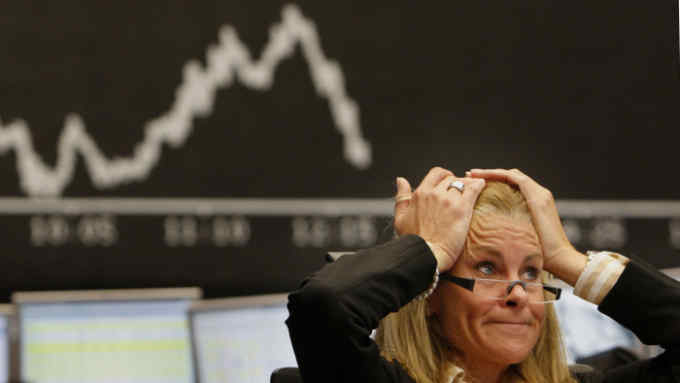 A broker reacts at the stock exchange in Frankfurt, central Germany, on Tuesday Sept. 16, 2008. European stock markets fell again on Tuesday caused by the U.S. financial crisis. (AP Photo/Daniel Roland)