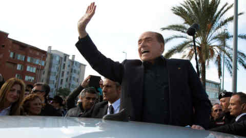 Former Italian Premier Silvio Berlusconi waves during a visit to Monserrato, near Cagliari, Italy, Thursday, Jan. 17, 2019. The three-time Italian premier, who has made a career out of rebounding from legal woes, personal scandal, heart trouble and political setbacks, said he is running for the European Parliament in May elections. The 82-year-old Berlusconi announced his candidacy with his center-right Forza Italia party Thursday in Sardinia. He said he wanted to &quot;bring my voice to a Europe that should change, a Europe that has lost profound thinking about the world.&quot; (Fabio Murru/ANSA via AP)