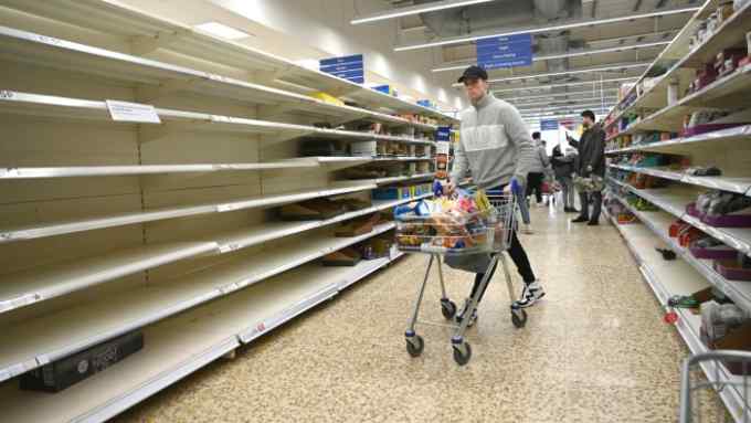 Mandatory Credit: Photo by NEIL HALL/EPA-EFE/Shutterstock (10583788c) A man pushes his trolley down empty pasta shelves in a supermarket in London, Britain, 15 March 2020. It has been reported that UK supermarkets have appealed to customers not to stockpile food due to coronavirus. Several European countries have closed borders, schools as well as public facilities, and have cancelled most major sports and entertainment events in order to prevent the spread of the SARS-CoV-2 coronavirus causing the Covid-19 disease. Coronavirus in Britain, London, United Kingdom - 16 Mar 2020
