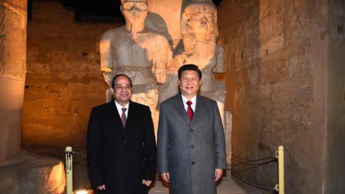 A handout picture provided by the Egyptian presidency shows Egypt's President Abdel Fattah al-Sisi (R) and China's President Xi Jinping (R) posing for the photographers during their visit to the luxor temple in the southern ancient city of Luxor on January 21, 2016. Jinping signed a slew of trade deals with Egypt's leader as part of a regional tour aimed at bolstering Beijing's economic ties and clout in the Middle East. / AFP / EGYPTIAN PRESIDENCY AND AFP / STRINGER (Photo credit should read STRINGER/AFP/Getty Images)