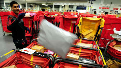 File photo dated 17/12/13 of Royal Mail staff sorting Christmas post at Nottingham Mail Centre as it was announced that the newly privatised deliver firm handled 115 million parcels in December as it continues to reap the benefit of the online shopping boom.