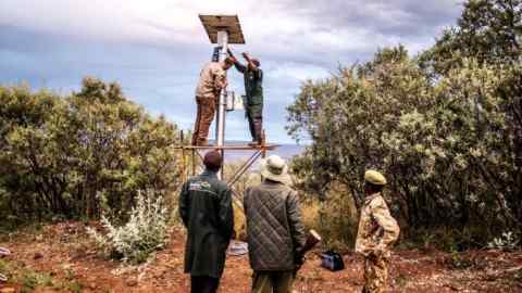 Predator watch: solar panels for the Flir camera system being installed in a national park in Kenya as part of WWF's wildlife crime technology project