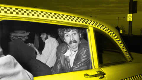 (Original Caption) 4/29/1973-New York, NY- Knick's Phil Jackson prepares to enter a cab at LaGuardia Airport, after the team's return from Boston and a 94-78 win over the Celtics. The Knicks will meet the Los Angeles Lakers in the NBA championship series.