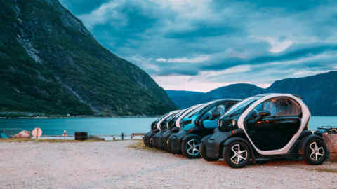 2A12CA4 Eidfjord, Norway - June 13, 2019: Many Black And Blue Colors Renault Z.E. Cars Parked In row. The Renault Z.E. or Zero Emission is a line of all-elec