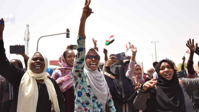 TOPSHOT - Sudanese demonstrators chant slogans as they gather in a street in central Khartoum on April 11, 2019, immediatly after one of Africa's longest-serving presidents was toppled by the army. - Organisers of protests for the ouster of Sudanese president Omar al-Bashir rejected his toppling by the army Thursday as a &quot;coup conducted by the regime&quot; and vowed to keep up their campaign. (Photo by AHMED MUSTAFA / AFP) (Photo credit should read AHMED MUSTAFA/AFP via Getty Images)