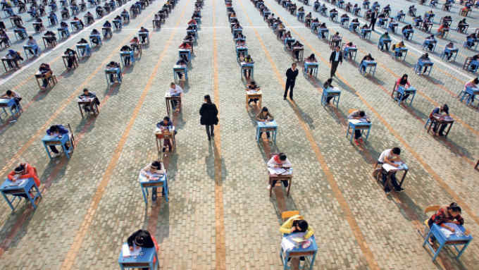 WUHAN, CHINA - NOVEMBER 10: (CHINA OUT) More than 1000 students take part in mid-term examination at the playground of Sihuang Middle School on November 10, 2011 in Wuhan, China. (Photo by VCG/VCG via Getty Images)