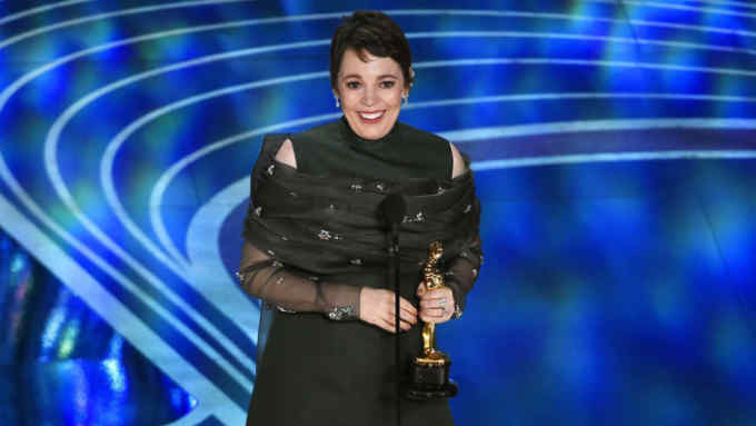 Olivia Colman accepts the award for best performance by an actress in a leading role for &quot;The Favourite&quot; at the Oscars on Sunday, Feb. 24, 2019, at the Dolby Theatre in Los Angeles. (Photo by Chris Pizzello/Invision/AP)