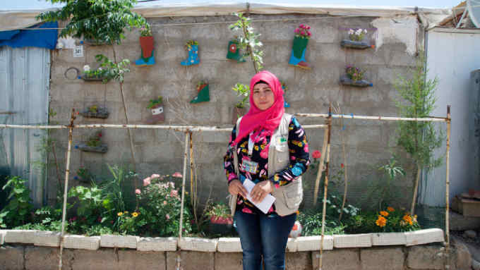 Aveen Ibrahim in her garden in the Domiz refugee camp