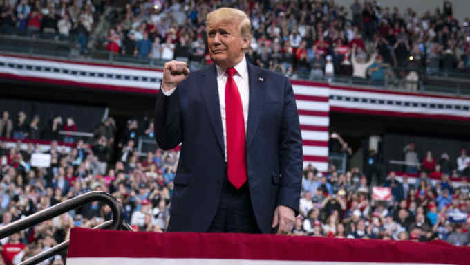 President Donald Trump arrives at SNHU Arena for a campaign rally, Monday, Feb. 10, 2020, in Manchester, N.H. (AP Photo/Evan Vucci)