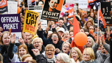 GLASGOW, SCOTLAND - OCTOBER 23: Demonstrators hold placards as they attend a rally in George Square following a march for equal pay for Glasgow council workers on October 23, 2018 in Glasgow, Scotland. Schools and home-care services were disrupted as an estimated 8,000 workers joined a 48-hour walkout, aimed at spurring the settlement of equal-pay claims from thousands of female workers. (Photo by Jeff J Mitchell/Getty Images)