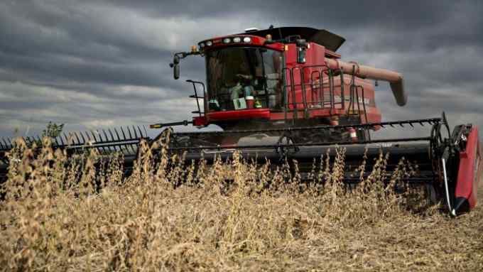Syngenta Group Co. NK Soybeans are harvested with a Case IH combine harvester near Tiskilwa, Illinois, U.S., on Thursday, Sept. 29, 2016. U.S. farmers are predicted to harvest a third straight record crop of soybeans this year. Photographer: Daniel Acker/Bloomberg