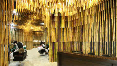 Hair salon featuring bamboo in Bangkok, Thailand, designed by NKDW
