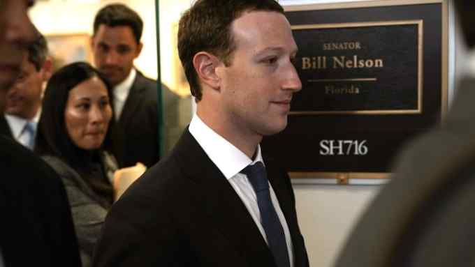 WASHINGTON, DC - APRIL 09: Facebook CEO Mark Zuckerberg (C) leaves after a meeting with U.S. Sen. Bill Nelson (D-FL), ranking member of the Senate Committee on Commerce, Science, and Transportation, April 9, 2018 on Capitol Hill in Washington, DC. Zuckerberg is scheduled to testify before a few Congressional committees this week on the mass users data Facebook has shared with political operatives. (Photo by Alex Wong/Getty Images)