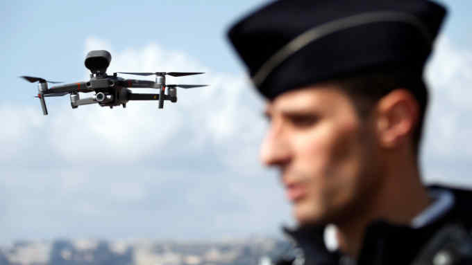 A drone, seen over the Promenade des Anglais, is used by French police reminding citizens of the coronavirus (COVID-19) confinement measures in Nice, France, March 20, 2020. REUTERS/Eric Gaillard - RC2NNF9BQW62