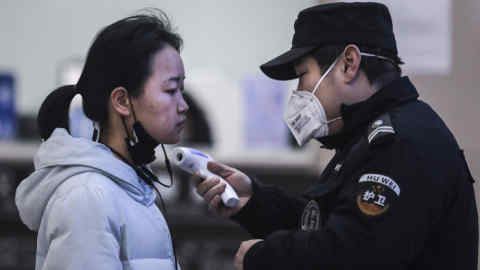WUHAN, CHINA - JANUARY 22: (CHINA OUT) Security personnel check the temperature of passengers in the Wharf at the Yangtze River on January 22, 2020 in Wuhan, Hubei province, China. A new infectious coronavirus known as &quot;2019-nCoV&quot; was discovered in Wuhan as the number of cases rose to over 400 in mainland China. Health officials stepped up efforts to contain the spread of the pneumonia-like disease which medicals experts confirmed can be passed from human to human. The death toll has reached 17 people as the Wuhan government issued regulations today that residents must wear masks in public places. Cases have been reported in other countries including the United States, Thailand, Japan, Taiwan, and South Korea. (Photo by Getty Images)