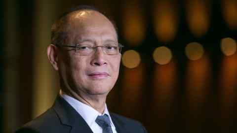 Benjamin Diokno, the Philippines' budget secretary, stands for a photograph before a Bloomberg Television interview in Singapore, on Tuesday, Aug. 15, 2017. Diokno discussed the spending priorities under Rodrigo Duterte, where they're going to get the money, his concerns over the peso, the free college tuition bill, the crisis in Marawi City, the Marawi reconstruction bond sale and the country's 2Q growth projection. Photographer: Sam Kang Li/Bloomberg