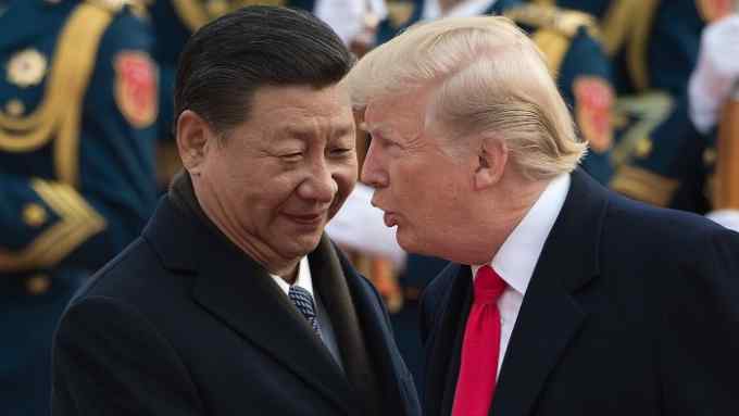 China's President Xi Jinping (L) and US President Donald Trump attend a welcome ceremony at the Great Hall of the People in Beijing on November 9, 2017. / AFP PHOTO / NICOLAS ASFOURI (Photo credit should read NICOLAS ASFOURI/AFP/Getty Images)